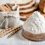 wheat and flour on the table highlighting the results of thorough grain processing